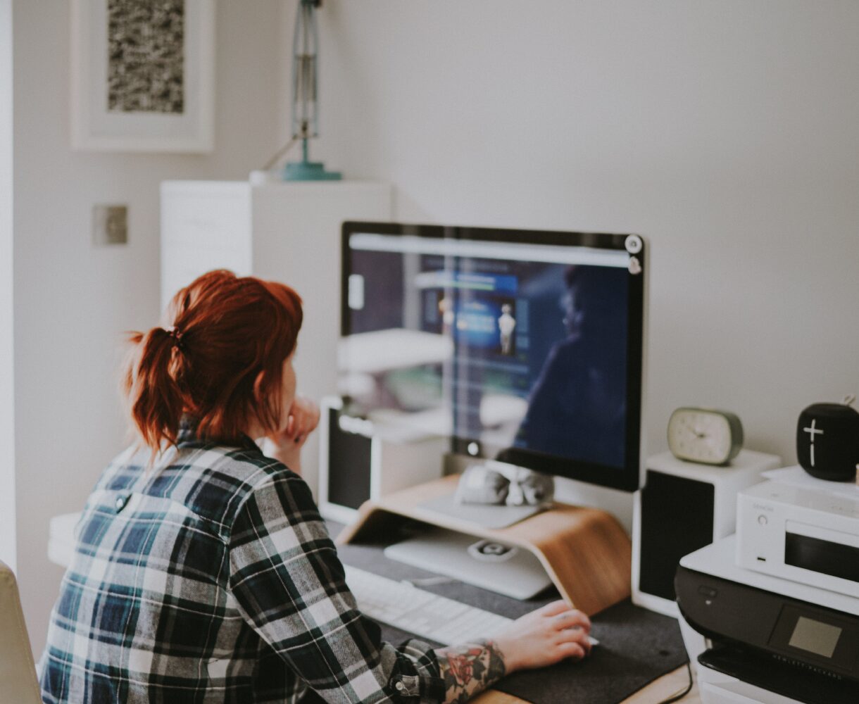 An employee sits at a desk, homeworking is one of many climate actions you can take